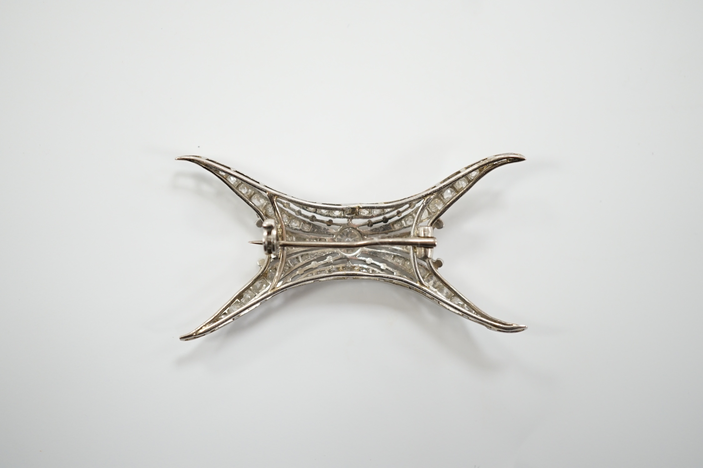 A 1920's white metal and millegrain set diamond cluster set brooch, 46mm, gross weight 5.2 grams.